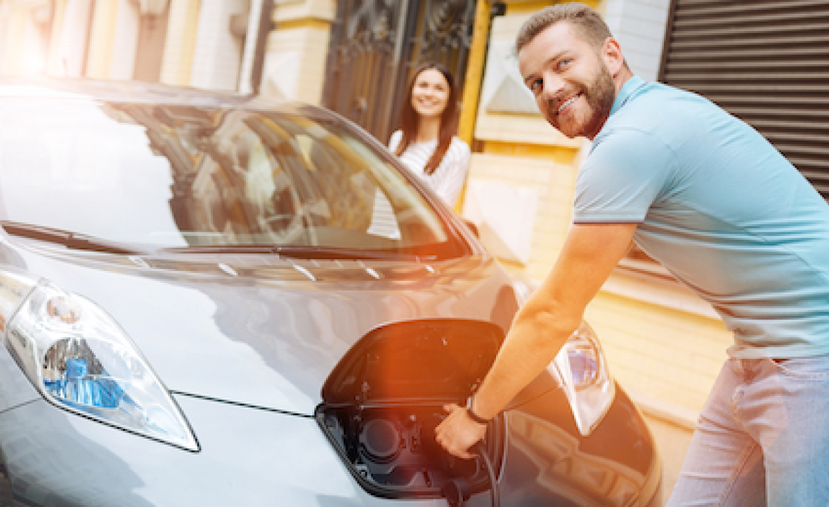 Man charging EV